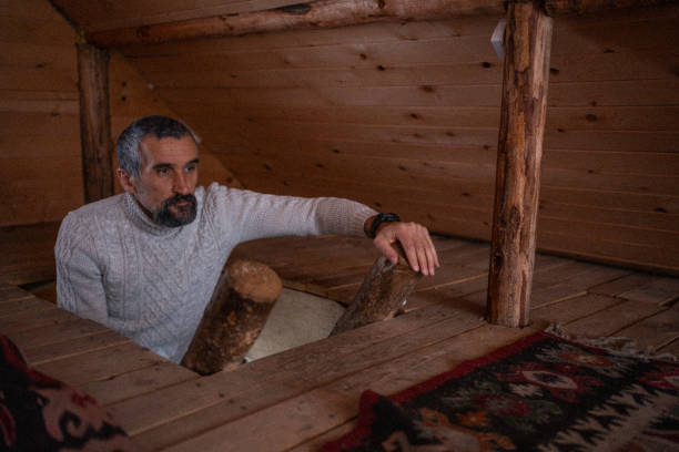 istock Cabin getaway. Man relaxes in log cabin. 1483117156