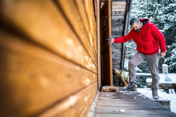 Log cabin winter retreat. Relaxing in sustainable wooden house.