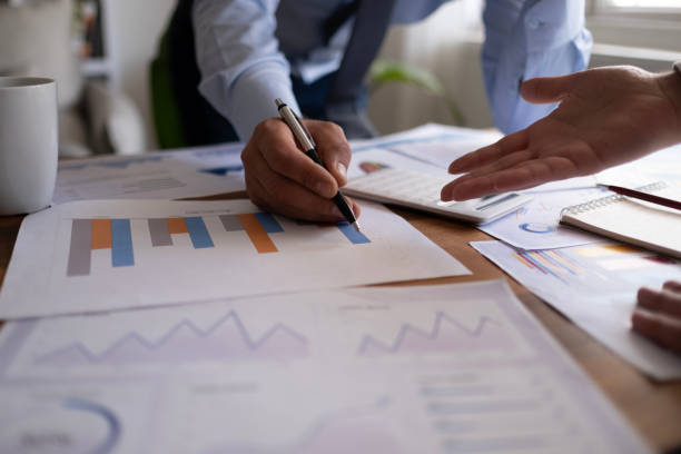 istock Business accounting concept, Business man using calculator with computer laptop, budget and loan paper in office. 1483117616