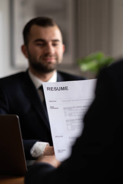 istock Audit resume applicant paper and interview with using computer laptop for selection human resource to company. 1483118808