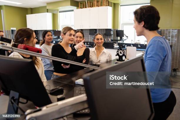 Girls In Stem Female Physics Teacher In Classroom With College Students Stock Photo - Download Image Now