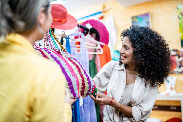 istock Young friends looking at merchandise on a store 1483120483