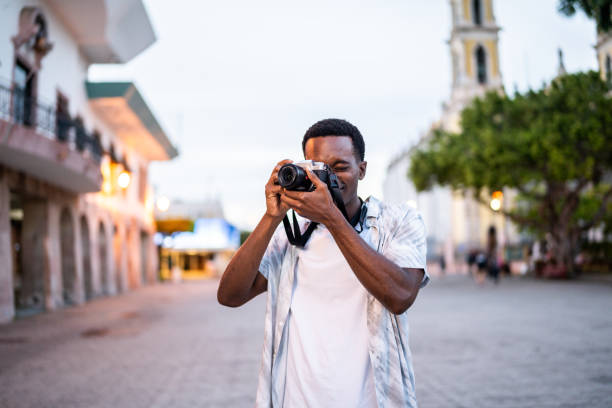 Young man taking pictures at the historic district