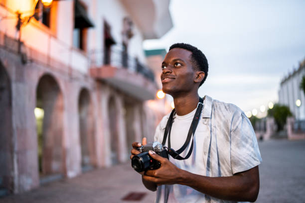 istock Young man walking and looking around exploring the city 1483120985
