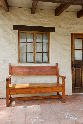 Antique pine bench on the adobe’s patio