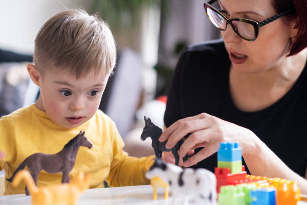 istock child with Down syndrome exploring their creativity and learning with colorful geometric shapes 1483125813