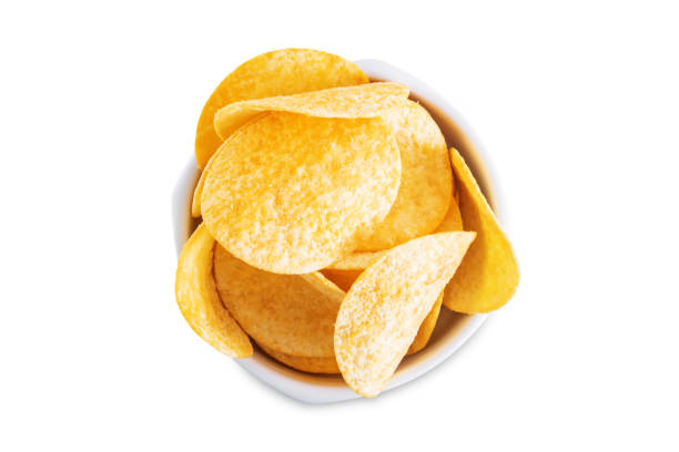 istock Yellow potato chips with salt and spices on a white isolated background 1483132412
