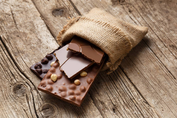istock Chocolate in a burlap bag on a wooden background. 1483133244