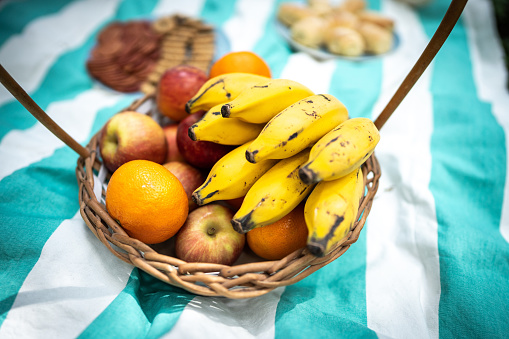 Basket with fruits on a tablecloth