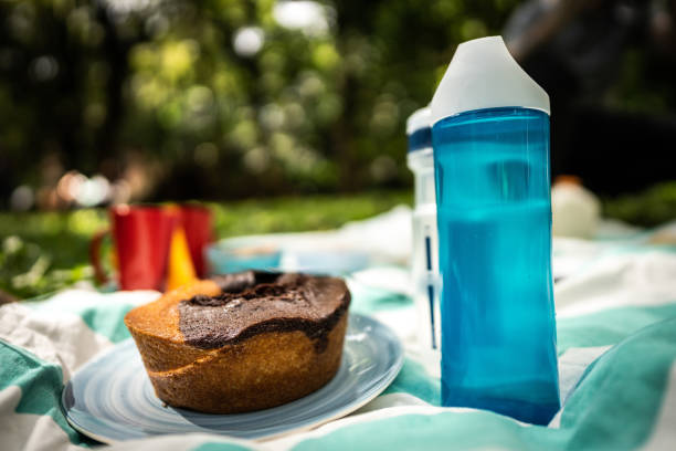 Cake and water bottles on a tablecloth