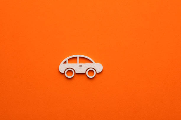 istock White car on orange colored background - car symbol for web site design or logo 1483139898
