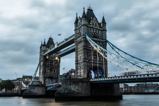 Tower Bridge in London England During Daytime Moody Overcast Sky Dramatic Heavy Contrast Long Exposure.