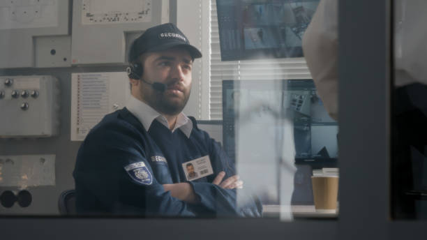 istock Security officer in headset talks with colleague 1483143507