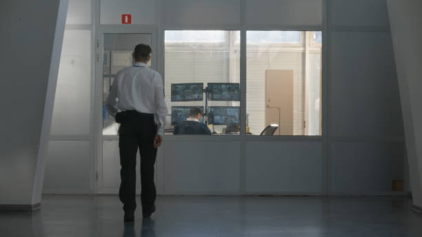 istock Security officer comes in observation room 1483144214