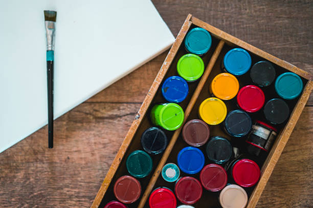 istock high angle view of a blank canvas, acrylics and other elements of a painter artist. Art workshop. 1483144561