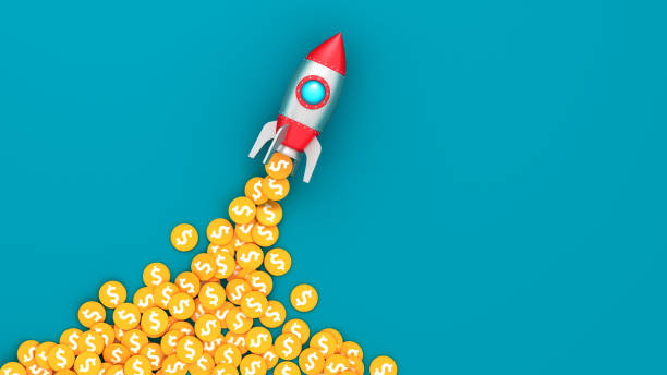istock Space rocket and coins with dollar sign on blue background. Lucky business startup. Successful takeoff. To the moon concept. 1483145252