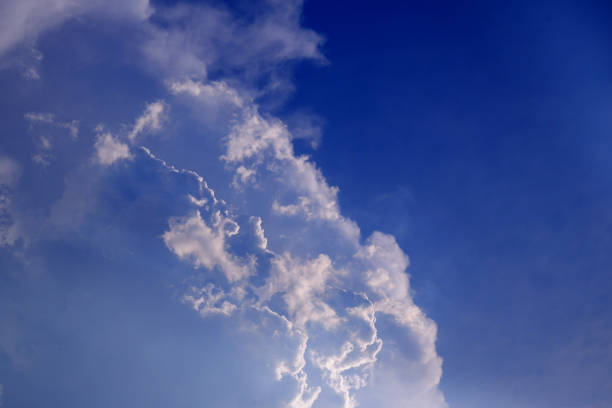 istock sun ray light through cloud on blue sky : can be used as background and dramatic look 1483145348