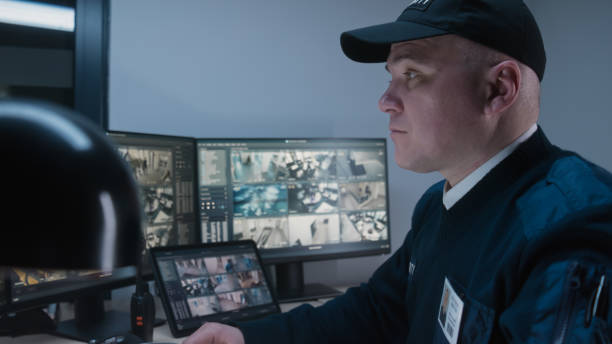 istock Security officer makes call by landline phone 1483145375