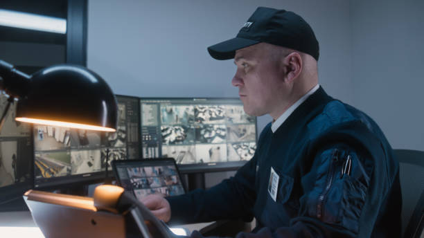 istock Security officer makes call by landline phone 1483145416