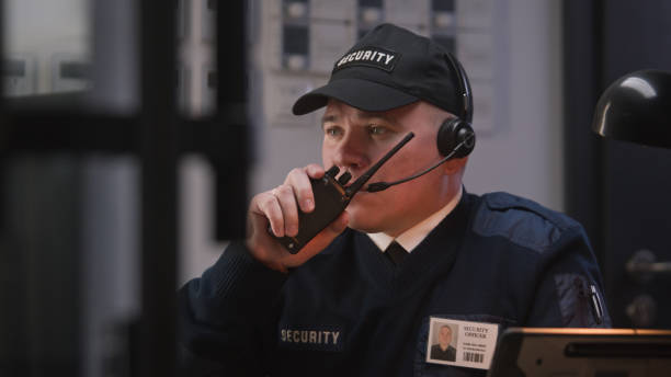 istock Busy security worker talks with coworker by walkie talkie 1483147162