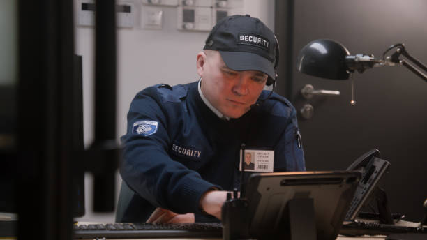 istock Busy security worker in headphones sits and typing keyboard 1483147254
