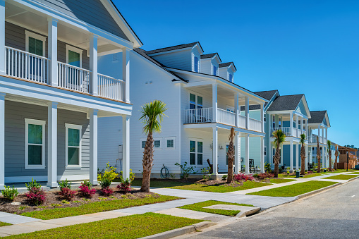New detached houses in a new residential district in Summerville, near Charleston, South Carolina, USA on a sunny day.