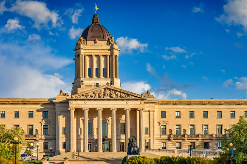 The Manitoba Legislative Building in downtown Winnipeg Manitoba Canada on a sunny day.