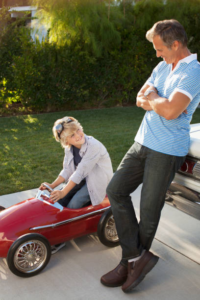 istock Father and son playing with go cart 148315063