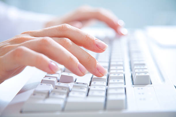 istock Close-up of hands typing on a computer keyboard 148315235