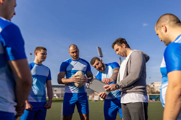 istock Rugby players talking tactics with coach 1483155423