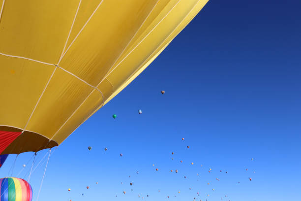 A beautiful yellow hot air balloon with copy space getting ready for flight at the Albuquerque International Balloon Festival in New Mexico