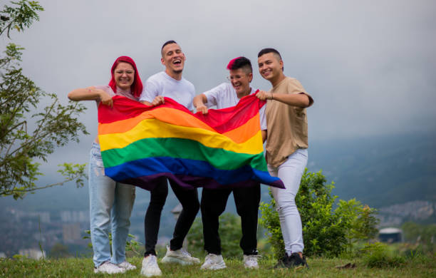 istock LGBTIQ+ community couples outdoors with the flag and sharing smiles 1483157379