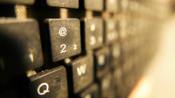 istock Keyboard close-up (@ key). Wireless keyboard. Numeric keyboard. PC keyboard. Dirty keyboard 1483162128