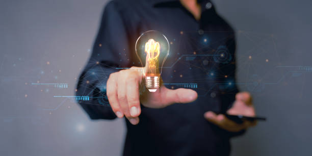 istock Creative solution or idea for web banner design or landing page template for creative agency with hands coming out of the screen with light bulbs and colorful abstract geometric shapes and lead lines. 1483163904
