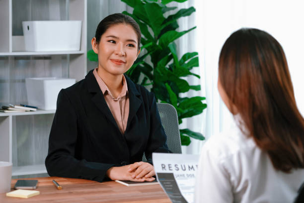 istock Two asian women conduct job interview in office. Enthusiastic 1483166521