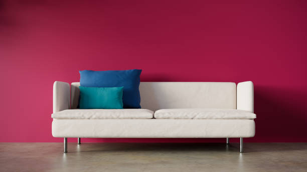 istock Front view of a two-seater white sofa with a magenta red wall behind it. 3d rendering 1483166668