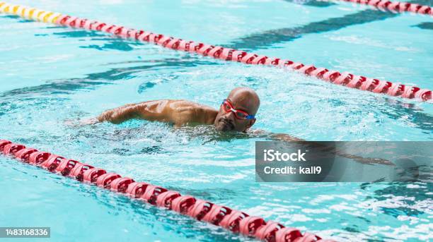 Senior Africanamerican Man At Pool Swimming Laps Stock Photo - Download Image Now - Swimming, Lap - Circuit, Adult