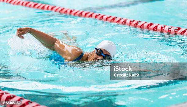 Senior Africanamerican Woman At Pool Swimming Laps Stock Photo - Download Image Now