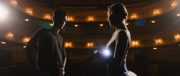 istock Ballerina talks about choreography with dance partner 1483168783
