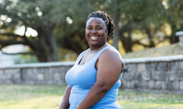 istock Plus size African-American woman at park, smiling 1483169935
