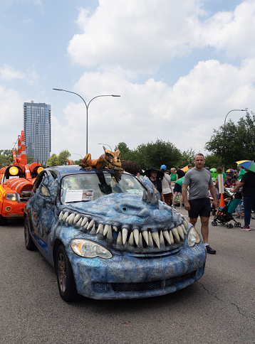 2023 Houston Art Car Parade called Frankie the PT Cruiser that's decorated with teeth and a monster.