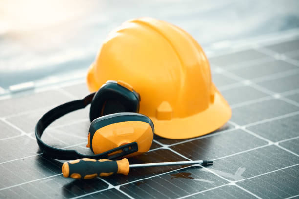 istock Solar panel maintenance, tools and outdoor by helmet, headphones or renewable energy by blurred background. Photovoltaic tech goals, sustainability vision and eco friendly electricity by screwdriver 1483170318