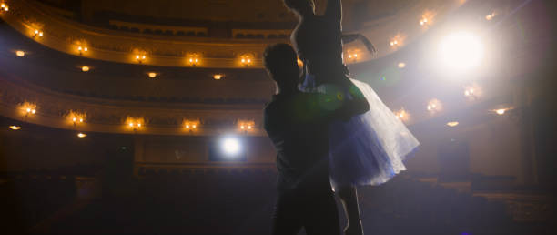 istock Ballet dancers practice ballet lifts on theater stage 1483170988