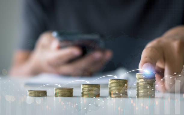 istock Hand touching coins stacking with infographic arrow jump step for growing business, saving, investment, business investment profit and dividend saving growth concept. 1483171084