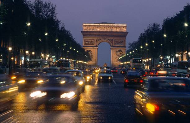 istock Road traffic on the Champ Elysee at dusk, Paris 1483172227