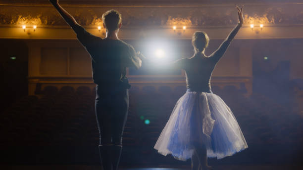 istock Ballet dancers bowing on classic theater stage 1483174136