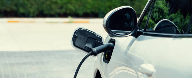 istock Closeup EV car and charger with blur background for progressive concept. 1483174271