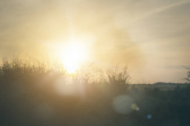 Relaxing outdoors vacation landscape concept: Abstract blurred sunlight beach colorful blurred bokeh background with retro effect autumn sunset sky have blue bright, white, and color orange calm.