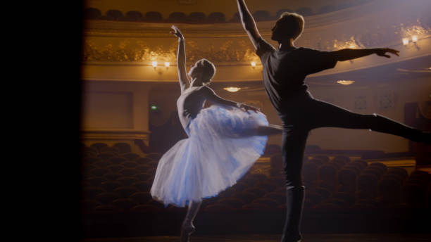 istock Ballerina dances with partner in training suit 1483176053