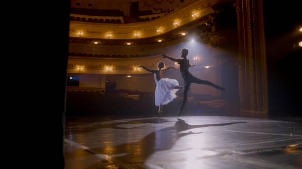 istock Ballerina dances with partner in training suit 1483176108
